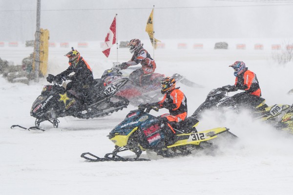 Despite a heavy snowfall, defending East Coast Snocross champion Danny Poirier (312) ran away with his third win in two days when he took the chequered flag in the Pro Open final. Photo Credit: Sébastien Desbordes 