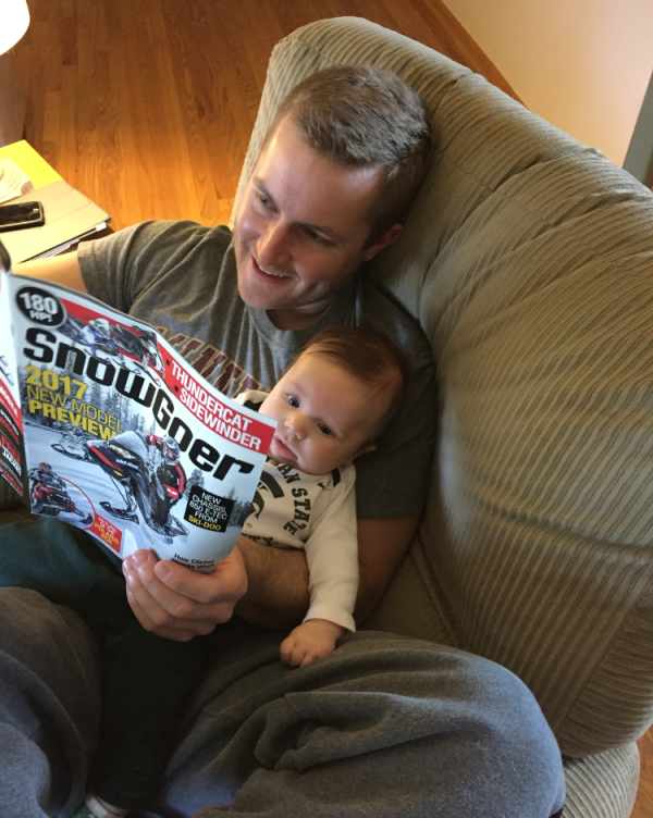 Understanding the importance of reading to your children. (Submitted by Dane Farber of Reese, Michigan; photographed with his son Hudson, 3 months)