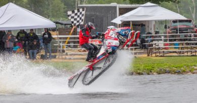 David Fischer snowmobile on water