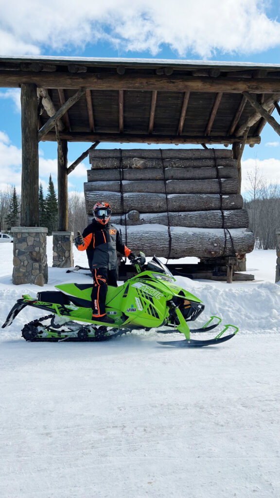 snowmobile with logs