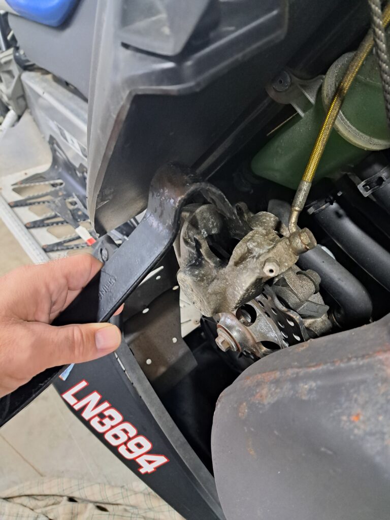 Push the caliper piston