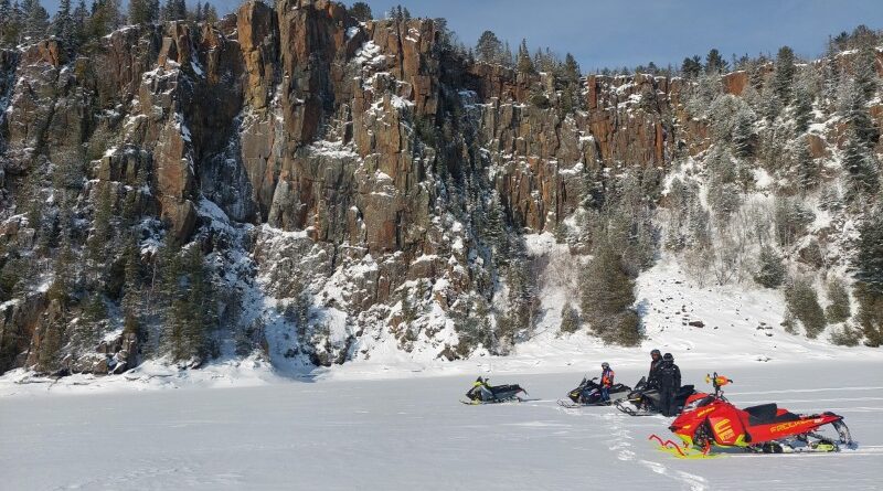 snowmobile by bluffs